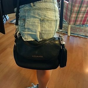 Michael Kors black and gold crossbody bag